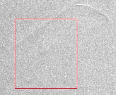 Conventional line-light capture of the source aluminium-film test; original red box retained.