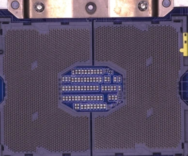 Source colour capture of a second processor socket on a blue board under a larger white shadowless ring light: contact fields either side of a centre area with small components. Complete capture, not retouched.