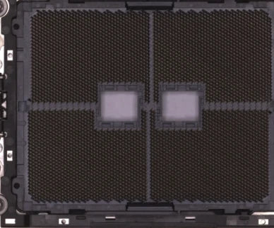 Source colour capture of a processor socket under a white shadowless ring light: two fields of fine contacts, a centre channel and two light windows. Complete capture, not retouched.