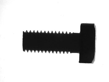White collimated-panel capture: the screw appears as a dark contour against a bright field.