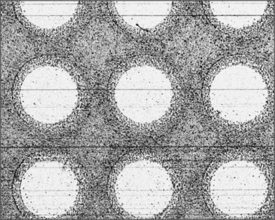 Source blue-coaxial capture: circular holes appear brighter than the textured surface around them.