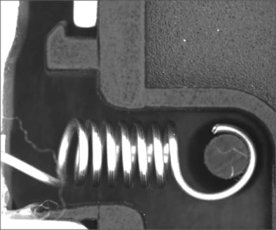 Source dome-lit capture of a coil spring, hook and adjacent mechanism.