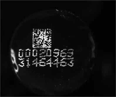 Separate source trial B: a smaller code and printed digits are visible under another UV ring version.