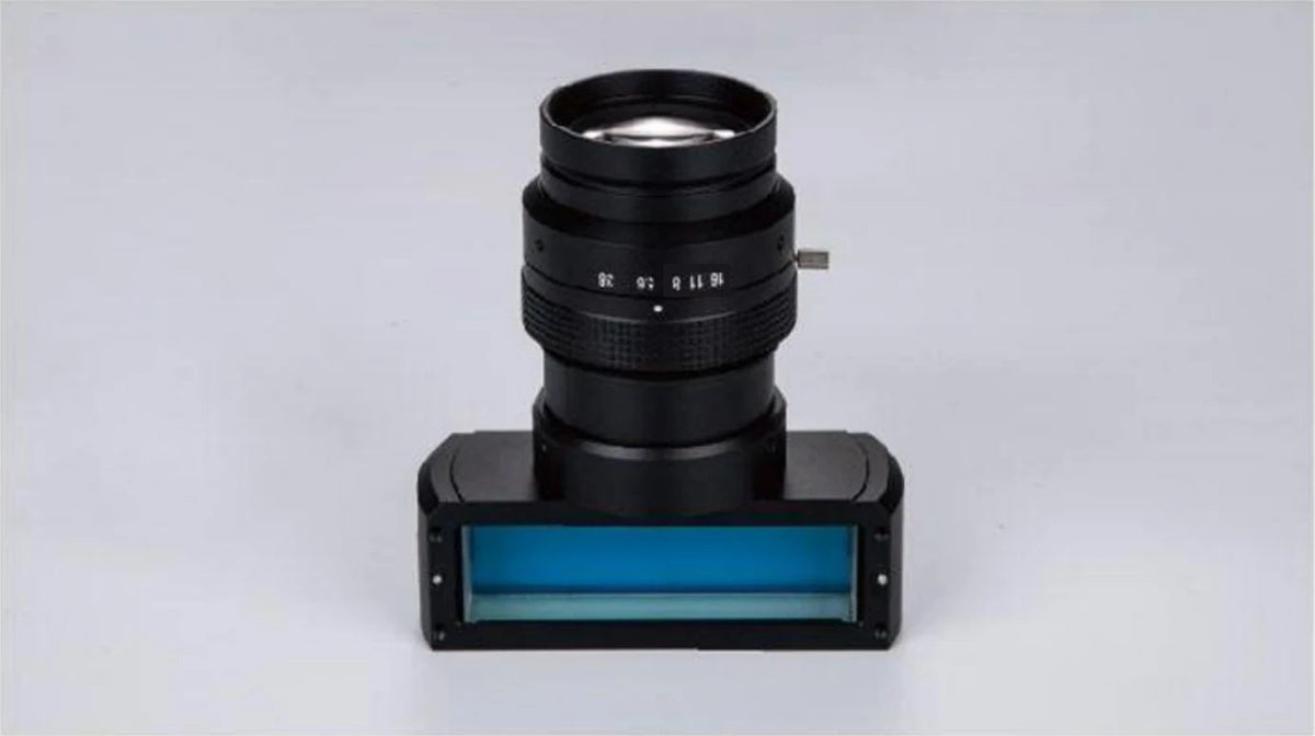 Coaxial illumination line scan lens